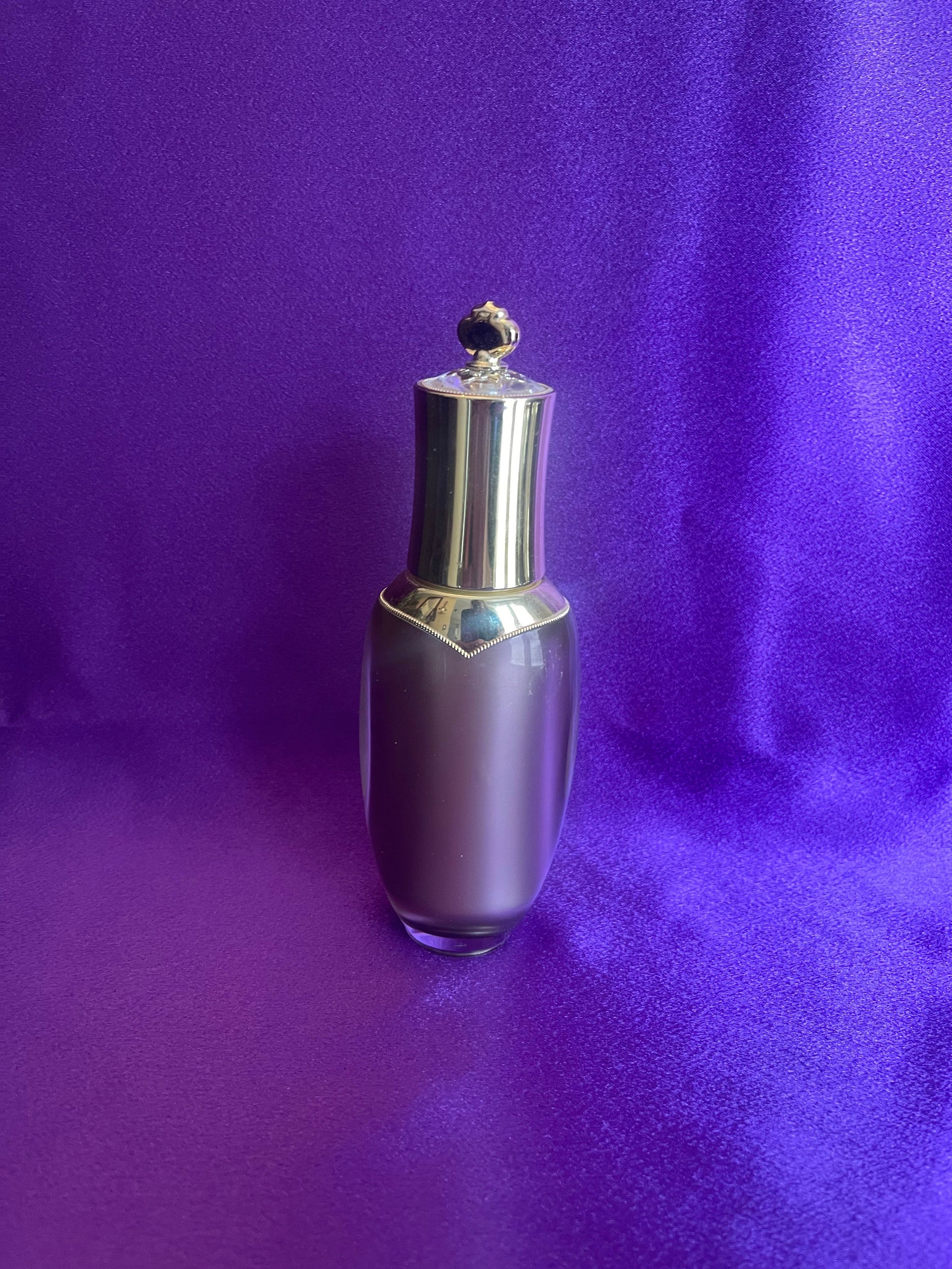 Silver and purple bottle Royal Adventure Skin, Royal Glow bottle on a purple background